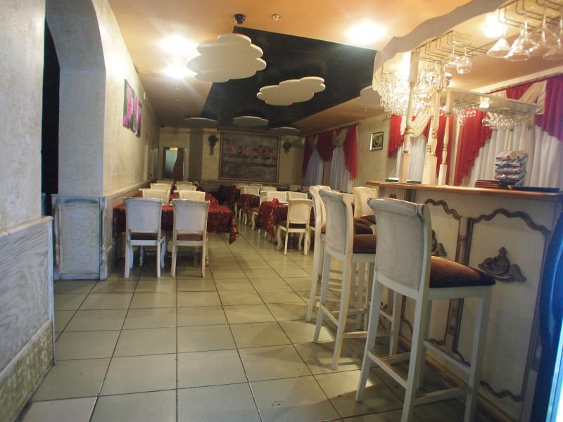 restaurant. two waitresses, one or two cooks, one guest