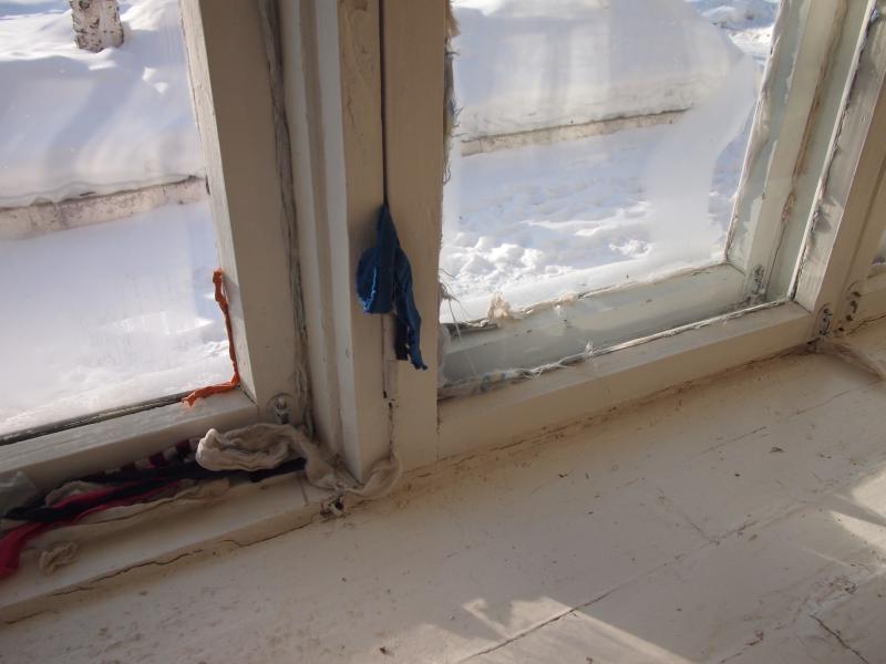 old clothes as insulation against draft from the windows. simple and
effective